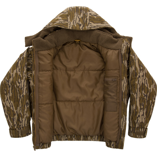 Throwback 80 Sport 3-in-1 Jacket featuring a camouflage pattern, quilted brown lining, fleecy hood, and interior zip-pocket, designed for all-weather outdoor adventures.