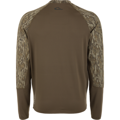 Back view of the BMF EST Offset 1.0 Crew shirt on a mannequin, featuring olive-brown waffle knit with Mossy Oak camo sleeves and ergonomic thumbholes.