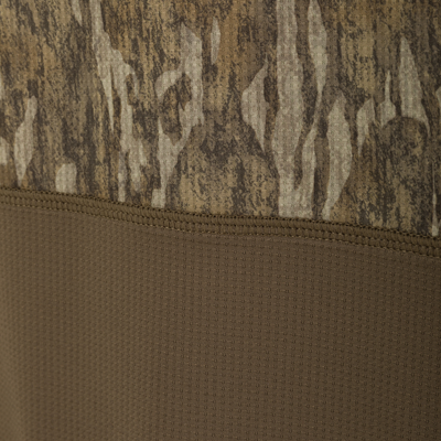 Close-up of BMF EST Offset 1.0 Crew, showcasing stitched woodland camo and breathable tan fabric, designed for comfort and performance in hunting conditions.