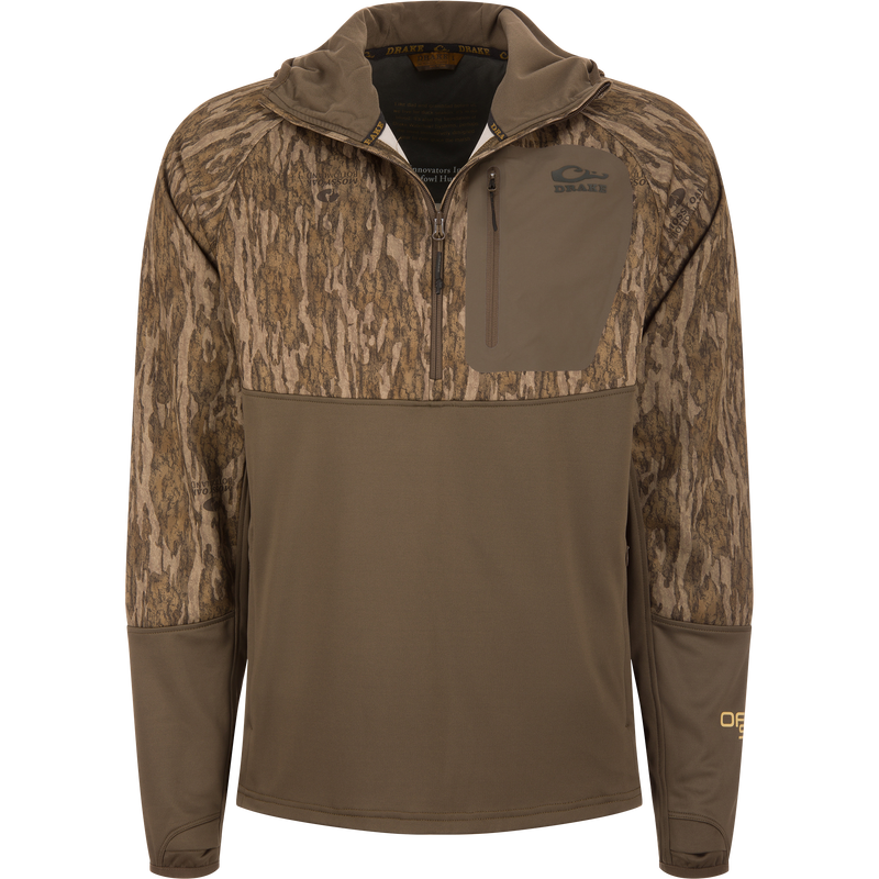 MST Offset 2.0 Half Zip Hoodie with tree-bark camouflage upper, solid brown lower, zippered chest pocket, and thumb-loop sleeves, designed for hunting comfort and functionality.