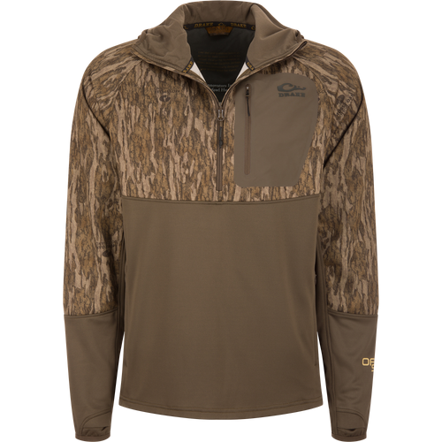 MST Offset 2.0 Half Zip Hoodie with tree-bark camouflage upper, solid brown lower, zippered chest pocket, and thumb-loop sleeves, designed for hunting comfort and functionality.