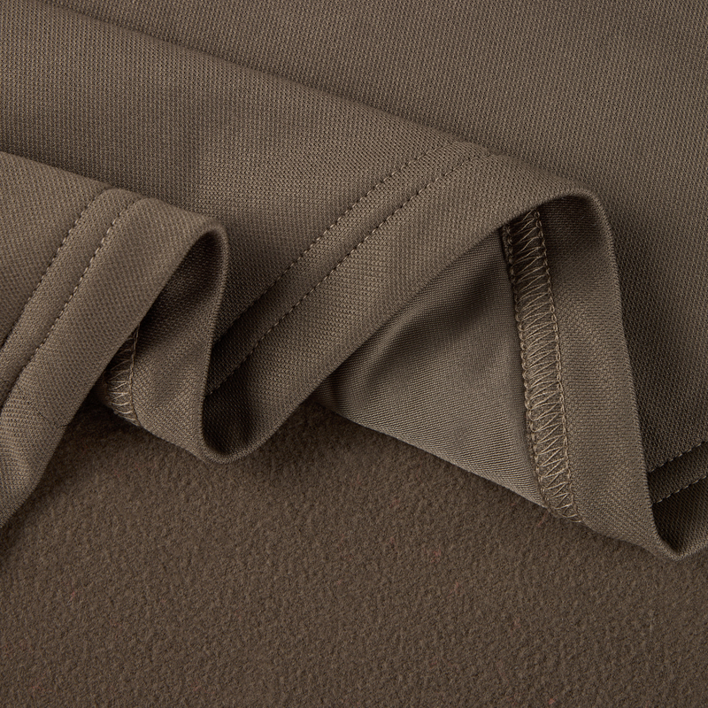 Close-up of MST Offset 2.0 Half Zip Hoodie fabric, showcasing its knit texture and soft brushed underside, exemplifying comfort and durability for outdoor adventures.
