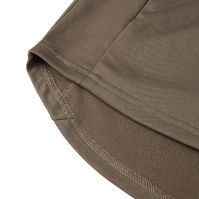 Close-up of the MST Offset 2.0 Half Zip Hoodie's hem, showcasing olive-brown outer fabric and soft fleece lining, highlighting its comfort and durability for outdoor adventures.