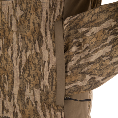 Close-up of LST BMF Jacket with Primaloft, showcasing camo-patterned fabric, zippered pocket, and seam, highlighting its durable, water-resistant, and insulated design for versatile, active use.
