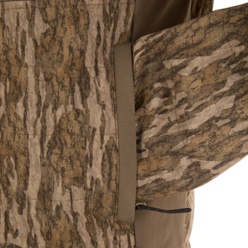 Close-up of LST BMF Jacket with Primaloft, showcasing camo-patterned fabric, zippered pocket, and seam, highlighting its durable, water-resistant, and insulated design for versatile, active use.