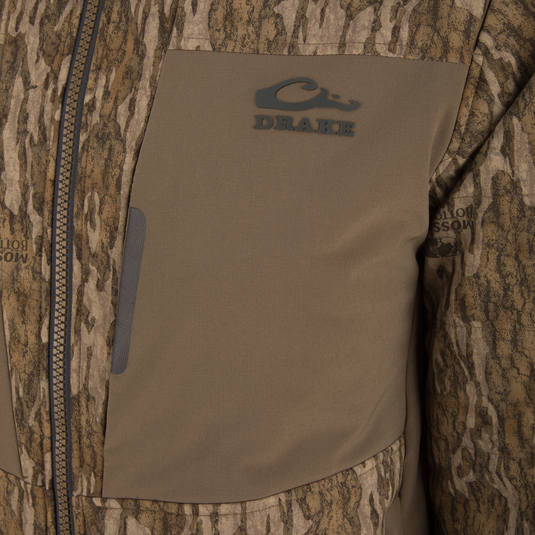 LST BMF Jacket with Primaloft features a camo pattern, Drake logo, and Mossy Oak print, showcasing a durable, water-resistant design with insulation and functional zippers.