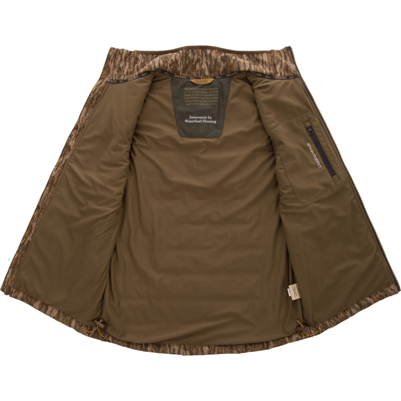 LST BMF Vest with Primaloft features an olive-green fleece body, camo trim, zippered stash pocket, and Innovators In Waterfowl Hunting patch, ideal for layering.