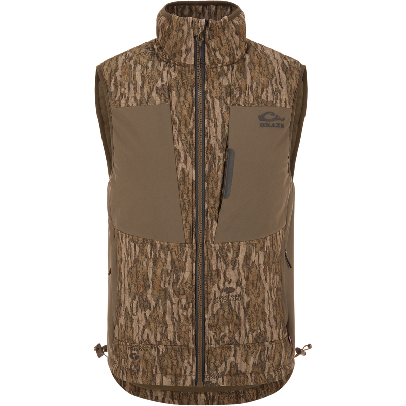 LST BMF Vest with Primaloft in Mossy Oak Bottomland camo, featuring a zip front, two chest pockets, and an adjustable hem for versatile hunting layering.