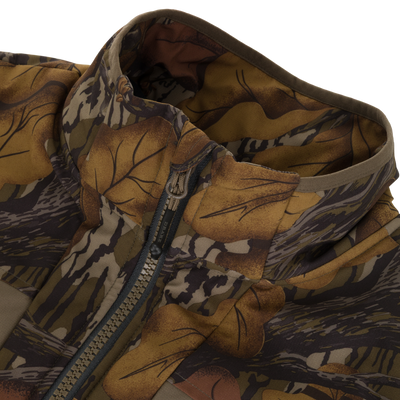 Close-up of a camouflage-patterned Drake X Ducks Unlimited LST BMF Vest with Primaloft featuring a high collar and a central zipper.