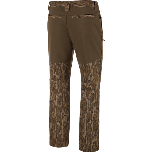 MST CommandXT Softshell Pant with bark-style camo and olive waistband, featuring belt loops, rear welt pockets, and zippered side pocket for outdoor activities.