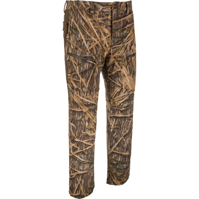 The Waterfowl MST CommandXT Softshell Pant in Mossy Oak Original Shadow Grass is windproof, water-resistant, and designed for hunting or outdoor use; shown against a plain white background.
