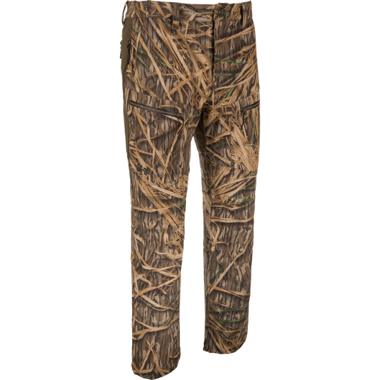The Waterfowl MST CommandXT Softshell Pant in Mossy Oak Original Shadow Grass is windproof, water-resistant, and designed for hunting or outdoor use; shown against a plain white background.
