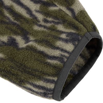 Close-up of the Camp Fleece Limited Edition Snap Pullover's sleeve in tiger-stripe camo, showcasing soft fleece texture and solid dark binding.