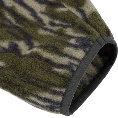 Close-up of the Camp Fleece Limited Edition Snap Pullover's sleeve in tiger-stripe camo, showcasing soft fleece texture and solid dark binding.