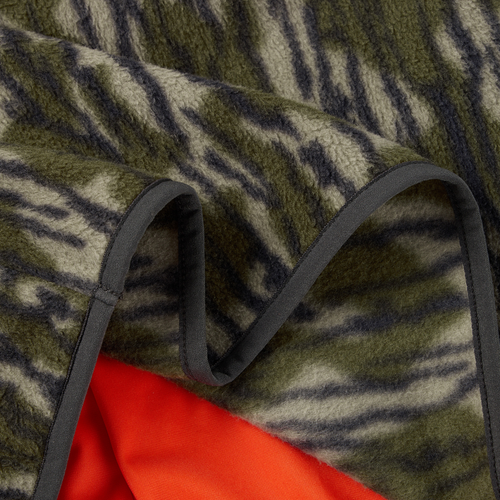 Camp Fleece Limited Edition Snap Pullover showcasing a green-and-dark-stripe fleece pattern with a bright red underside, featuring open side pockets and black binding.