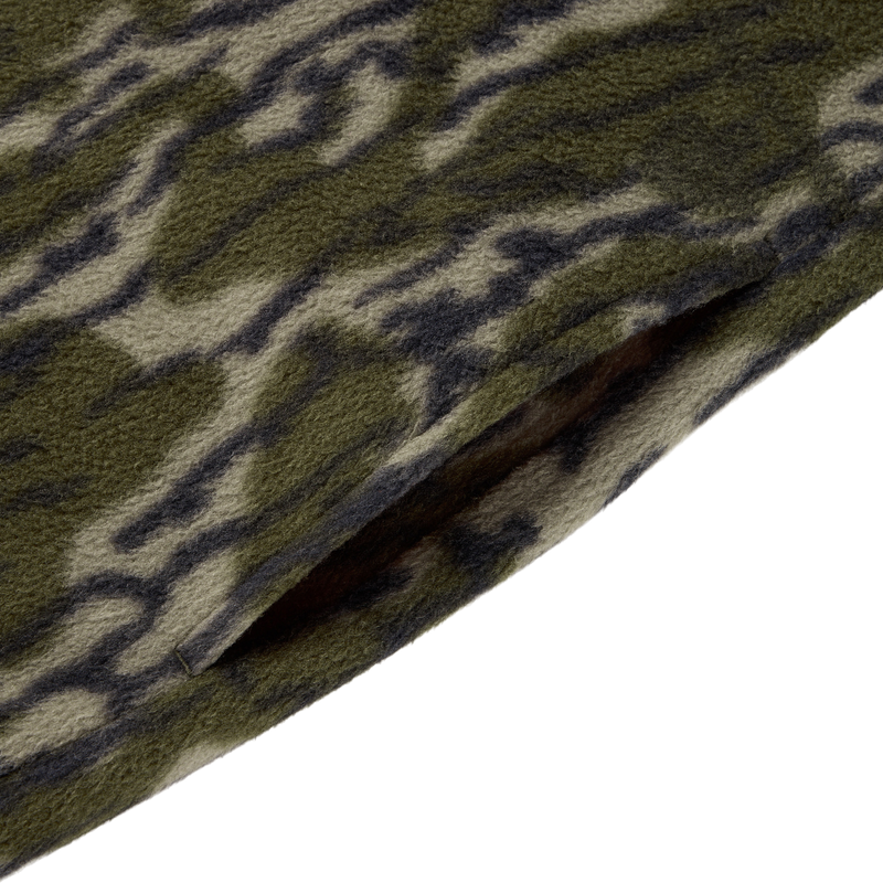 Close-up of the Drake Camp Fleece Limited Edition Snap Pullover, featuring a camouflage-patterned fleece with a slanted pocket slit and side entry pockets.
