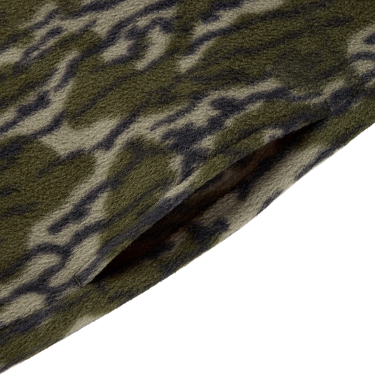 Close-up of the Drake Camp Fleece Limited Edition Snap Pullover, featuring a camouflage-patterned fleece with a slanted pocket slit and side entry pockets.
