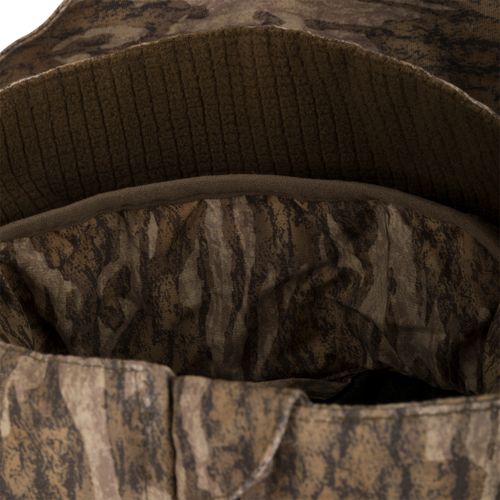 Inside view of LST CommandXT 3-in-1 PrimaLoft Insulated Jacket, showcasing camouflage-patterned fabric lining and ribbed fleece sweatband, ideal for versatile hunting conditions.