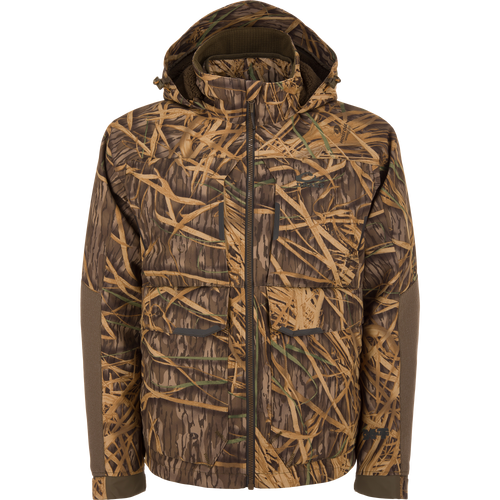 CommandXT 3-in-1 PrimaLoft Insulated Jacket with camouflage pattern, featuring a high collar, large flap pockets, reinforced elbows, and a full-zip hood for versatile outdoor protection.