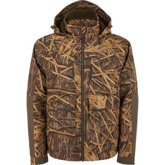 CommandXT 3-in-1 PrimaLoft Insulated Jacket with camouflage pattern, featuring a high collar, large flap pockets, reinforced elbows, and a full-zip hood for versatile outdoor protection.