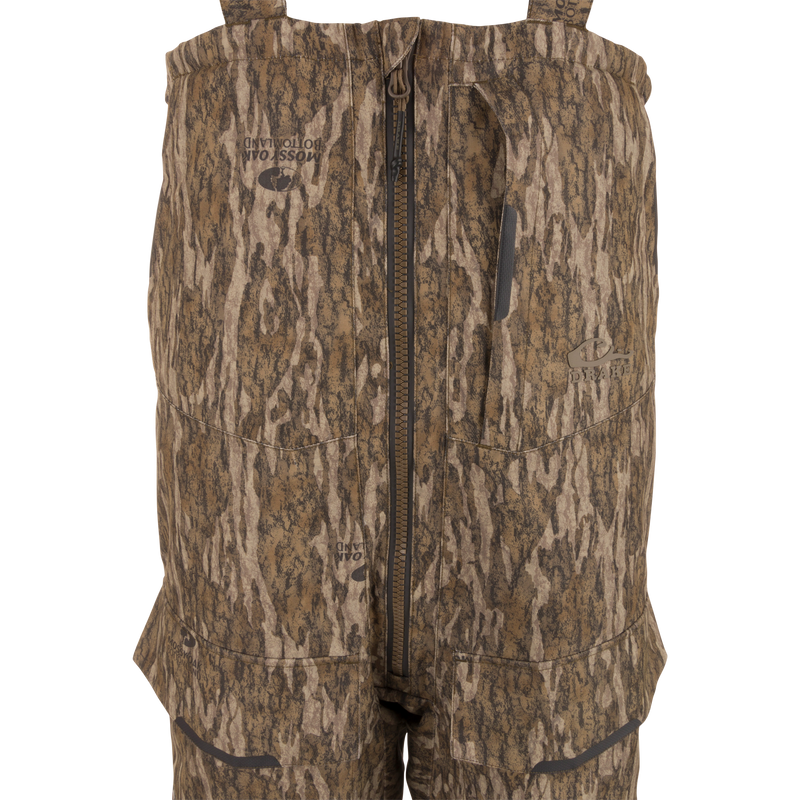 LST CommandXT Bib with Primaloft features camo-pattern, adjustable suspenders, center zipper, and reinforced panels, designed for extreme hunting conditions and durability.