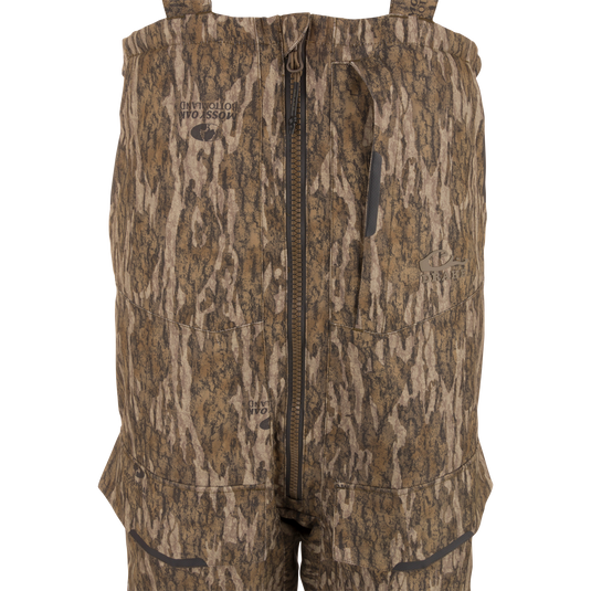 LST CommandXT Bib with Primaloft features camo-pattern, adjustable suspenders, center zipper, and reinforced panels, designed for extreme hunting conditions and durability.
