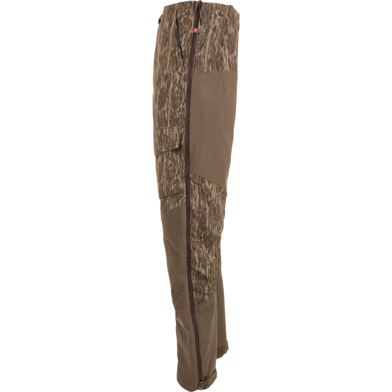 Side-view of LST CommandXT Bib with PrimaLoft, showing camo fabric, reinforced panels, and full-length side zipper, designed for extreme hunting conditions.