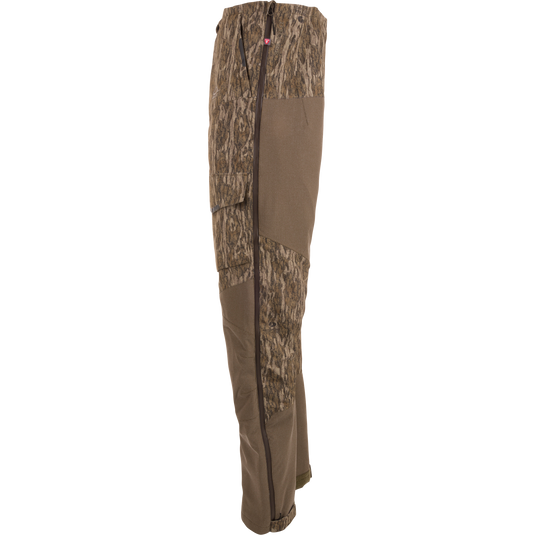 Side-view of LST CommandXT Bib with PrimaLoft, showing camo fabric, reinforced panels, and full-length side zipper, designed for extreme hunting conditions.