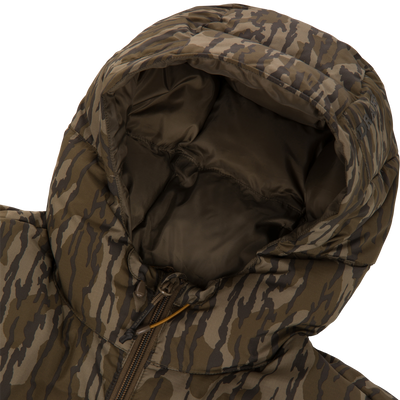 Close-up of BMF Down Jacket in camouflage print, showcasing padded quilting, hood lining, and zipper with pull cords, designed for warmth and durability in hunting conditions.