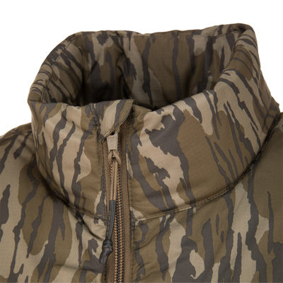 Close-up of the BMF Drake Down Vest's quilted collar, YKK zipper, and drawcord toggle, showcasing the durable, padded design ideal for layering in hunting conditions.