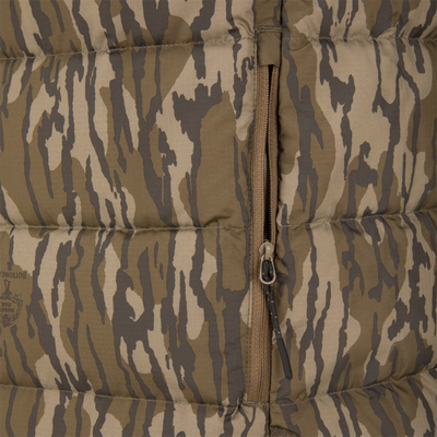 Close-up of BMF Drake Down Vest featuring tiger-stripe camouflage, padded insulation, and central zipper, designed for layering and core warmth in harsh hunting conditions.