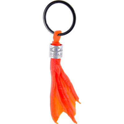 Duck Foot Key Chain: A molded-silicone, webbed-foot decoy weight with DRAKE metal collar and black O-ring, ideal for hunters and outdoors enthusiasts.