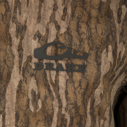 Close-up of the LST BMF Eqwader Half Zip Jacket with Primaloft, featuring a camouflage pattern and Drake's duck logo, highlighting its durable, waterproof, and insulated design.