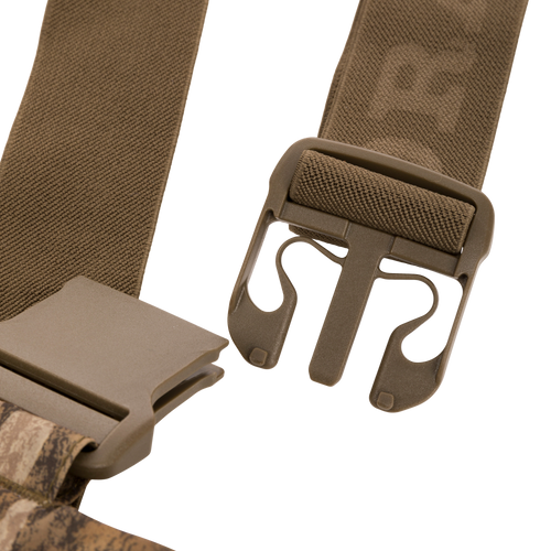 Close-up of durable quick-release buckle on nylon webbing, part of the LST BMF Pit Bib designed for rugged performance in hunting and outdoor activities.