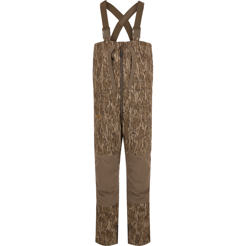 LST BMF Pit Bib with Primaloft: Camo-patterned hunting bib pants with reinforced brown fabric, adjustable suspenders, central front zipper, knee pads, and side zips for rugged performance.