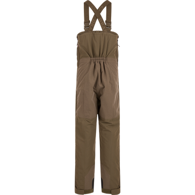 Back view of olive green Drake X Ducks Unlimited LST BMF Pit Bib with Primaloft waterproof hunting overalls, featuring adjustable shoulder straps with branded webbing and an elasticated waist.