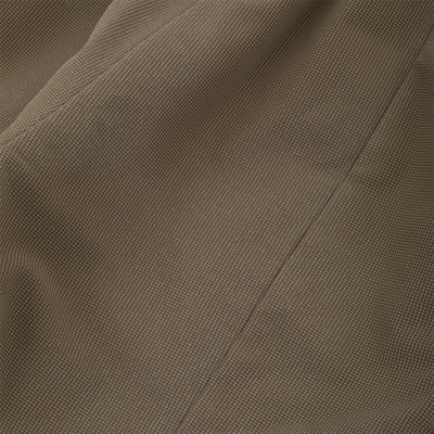 Close-up of olive green, micro-grid textured fabric with a vertical seam on a Drake X Ducks Unlimited LST BMF Pit Bib with Primaloft.