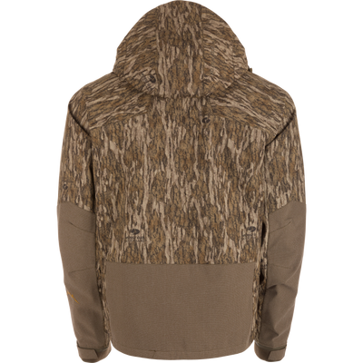 Back view of the LST BMF Pit Jacket with Mossy Oak Bottomland camo, solid brown accents, adjustable hood and cuffs, engineered for extreme weather conditions.