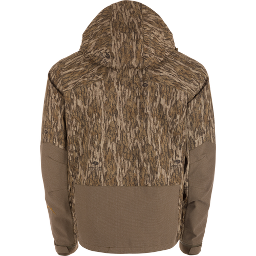 Back view of the LST BMF Pit Jacket with Mossy Oak Bottomland camo, solid brown accents, adjustable hood and cuffs, engineered for extreme weather conditions.