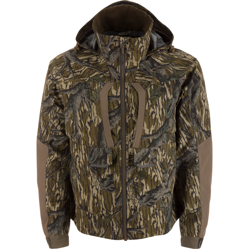 LST BMF Pit Jacket on mannequin, featuring camouflage pattern, adjustable hood, reinforced elbows, and chest pockets, designed for extreme outdoor conditions with durable, weather-resistant materials.