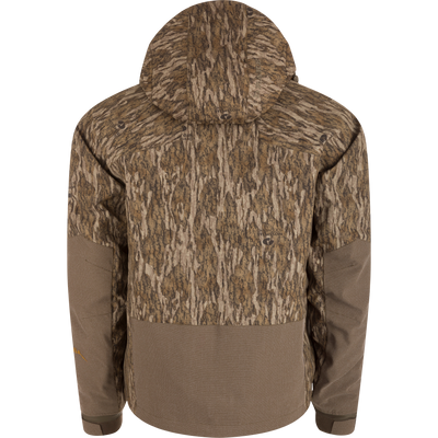 Back view of the LST BMF 3-in-1 Pit Jacket with Primaloft, featuring a Bottomland camouflage pattern and waffle-textured brown accents on hem and forearms.
