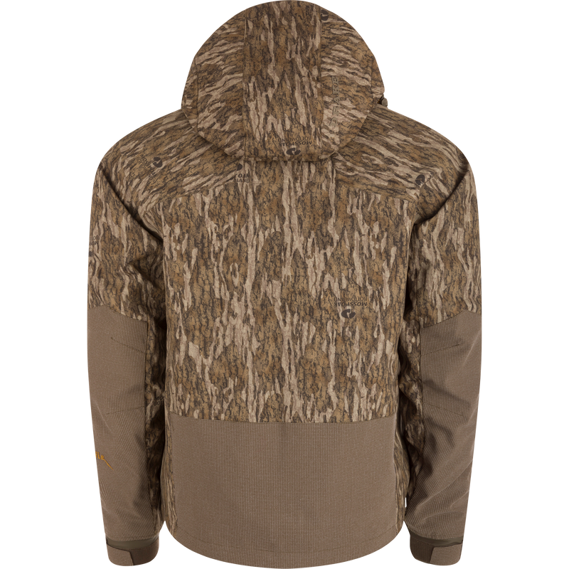Back view of the LST BMF 3-in-1 Pit Jacket with Primaloft, featuring a Bottomland camouflage pattern and waffle-textured brown accents on hem and forearms.