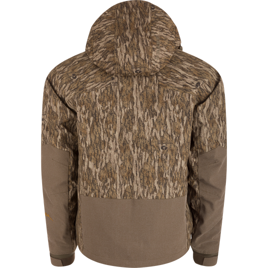 Back view of the LST BMF 3-in-1 Pit Jacket with Primaloft, featuring a Bottomland camouflage pattern and waffle-textured brown accents on hem and forearms.
