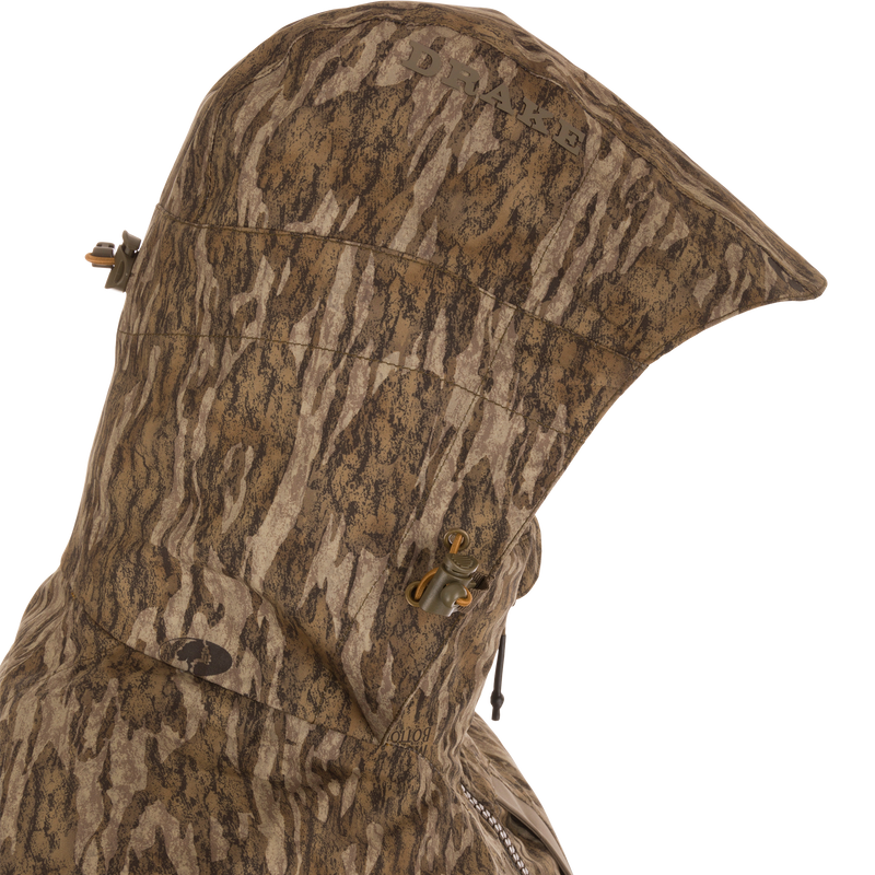The LST BMF 3-in-1 Pit Jacket features a camo hood with Drake logo, adjustable drawcords, and sherpa fleece lining for warmth.