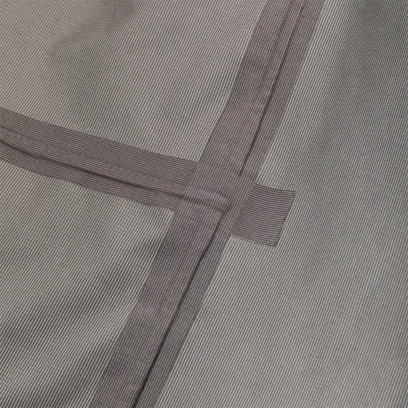 Close-up of grey woven fabric panel with crisscross darker-grey nylon webbing straps, part of the LST BMF 3-in-1 Pit Jacket with Primaloft.