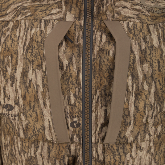 LST BMF 3-in-1 Pit Jacket featuring a central zipper, angled chest-pocket openings, and Mossy Oak/Drake branding in a tree-bark camo pattern.