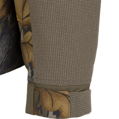 Close-up of a Drake X Ducks Unlimited LST BMF 3-in-1 Pit Jacket with Primaloft sleeve, featuring a textured brown forearm panel and an adjustable cuff.