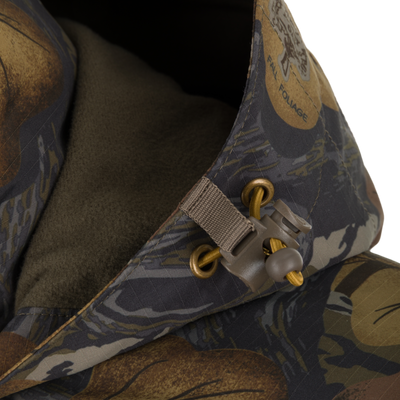 Close-up of a Drake X Ducks Unlimited LST BMF 3-in-1 Pit Jacket with Primaloft hood, featuring a soft fleece lining and a functional drawstring adjustment toggle.