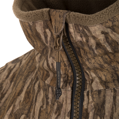 Close-up of the MST CommandXT Eqwader Full Zip Jacket, showcasing the fleece-lined hood, chunky zipper, and draw-cord toggle, highlighting its rugged design for demanding conditions.