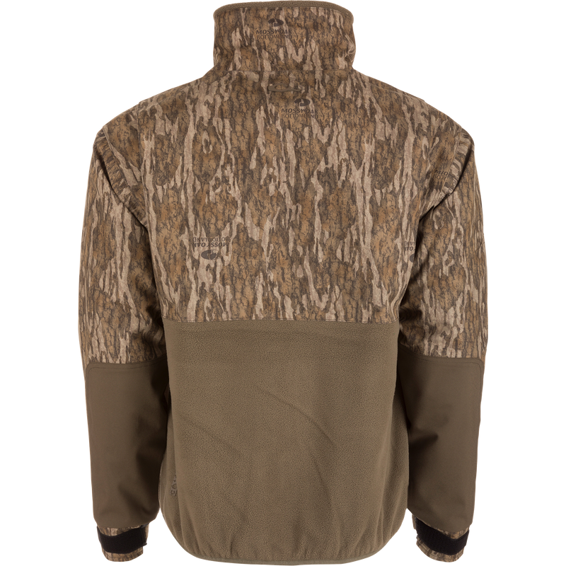 MST CommandXT Eqwader Half Zip Jacket's back view, featuring Mossy Oak camouflage, olive fleece, stand-up collar, elasticized hem, and adjustable cuffs for weather protection and durability.